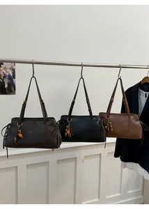 Three vintage tote bags in coffee, black, and tan colors with wooden bead charms