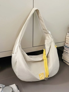 Off-white crescent cycling crossbody bag with mesh texture and yellow RG logo