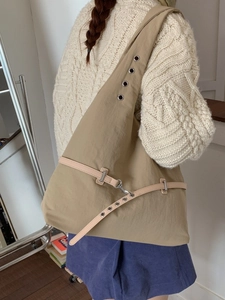 Khaki large capacity shoulder bag with eyelet details and functional industrial style