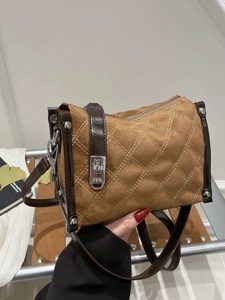 Chic quilted crossbody bag in camel suede with dark brown trim and silver buckle
