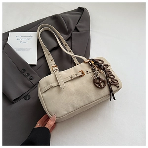 Detail view of beige retro shoulder bag featuring crackle PU leather and buckle strap