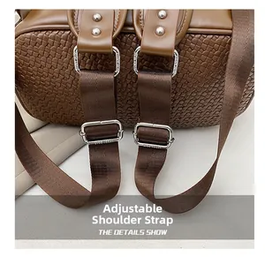 Detail of brown woven leather backpack with adjustable nylon straps and silver buckles