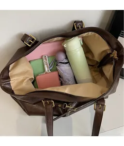 Top view of spacious brown tote bag interior showing large capacity for daily essentials