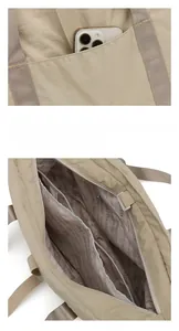 Détails du sac fourre-tout en nylon kaki avec compartiments internes et poche téléphone