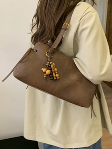 Classic brown faux leather shoulder bag with vintage wood bead and gourd tassel charm