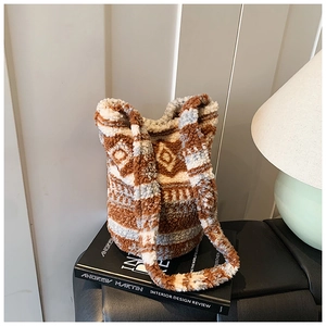 Close-up of geometric jacquard plush bucket bag with soft texture for fall and winter