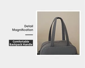Detail view of large travel bag with comfortable padded handles and dual metal zippers