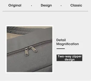 Detail magnification of the gray travel bag showing its durable dual-way metal zipper