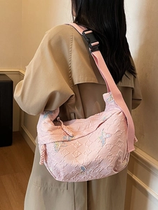 Pink quilted canvas crossbody bag with butterfly embroidery for women's daily commute