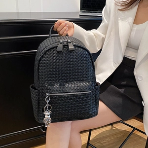Fashionable black woven faux leather backpack with silver bear charm and large capacity