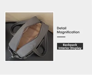 Detail showing the spacious interior compartment and smooth zipper of the gray travel bag