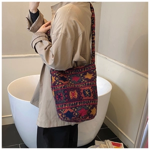 Detailed view of bohemian fleece tote bag with vibrant ethnic patterns on model