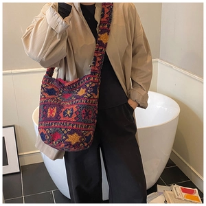 Ethnic plush bucket bag with colorful patterns and a wide strap for autumn winter