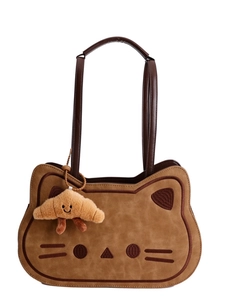 Cute brown cat-shaped tote bag with plush croissant charm and embroidered face details