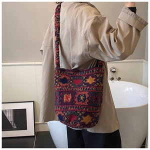 Detailed view of bohemian fleece bucket bag featuring ethnic geometric patterns and soft texture