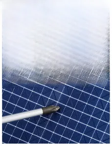 Macro shot of blue checkered fabric showing scratch-resistant nylon material for backpack