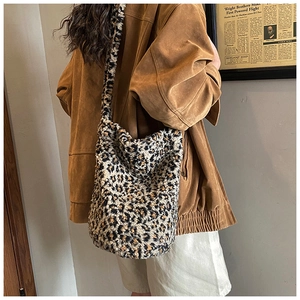Detailed view of the soft faux fur texture and leopard print pattern on this bucket bag
