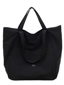Classic black minimalist tote bag with dual handles and metal logo detail on white background