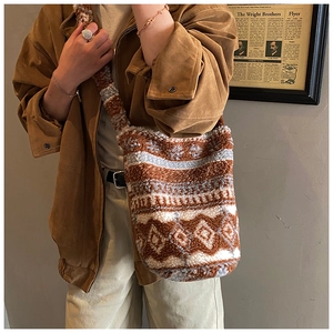 Ethnic bucket bag detail showing plush texture and geometric patterns for autumn fashion