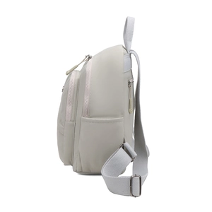 Side view of lightweight washed cloth backpack showing side pockets and adjustable straps