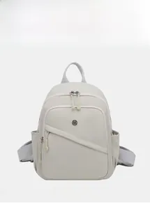 Detail view of the grey lightweight casual backpack with dual zippers and front pocket