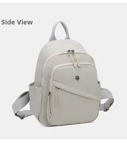 Close-up of lightweight nylon backpack with side pockets and smooth zipper details