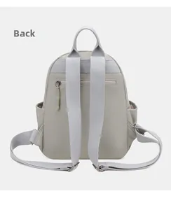 Back view of a grey nylon backpack featuring anti-theft zipper and wide shoulder straps