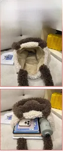 Internal view of the plush shoulder bag showing large capacity for tablet and daily items