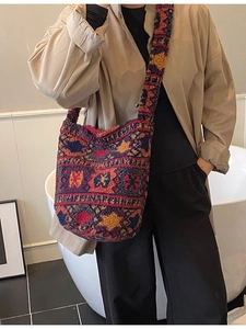 Bohemian style colorful knit bucket bag with ethnic geometric patterns and wide strap