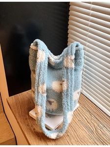 Plush light blue bucket bag with cloud patterns and thick shoulder strap for autumn