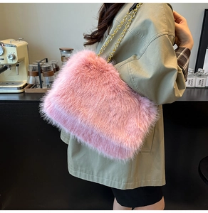 Close-up of pink faux fur tote bag with golden metal chain strap on model