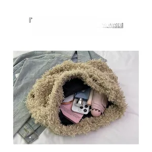 Detail view of large capacity beige plush tote bag interior with everyday essentials