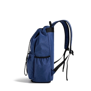 Detail view of the drawstring closure and side elastic mesh pocket on a blue gym bag