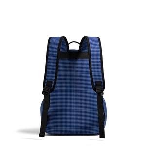 Detail view of reinforced black shoulder straps and buckle on blue checkered backpack