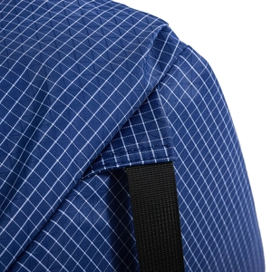 Close-up of blue ripstop nylon fabric and reinforced stitching on drawstring backpack