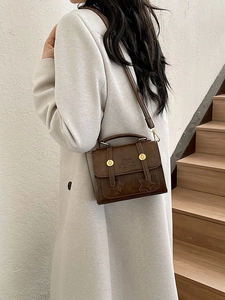 Vintage brown PU leather crossbody bag with star embossing and gold hardware detail
