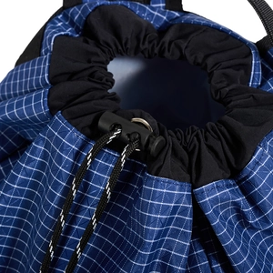 Close-up of durable blue checkered drawstring bag with adjustable toggle and woven rope