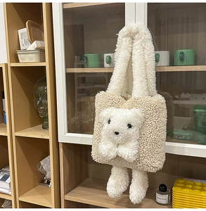 Close-up of fuzzy cream teddy bear tote bag showing soft sherpa fleece texture