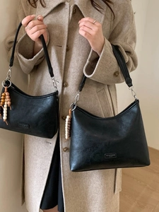 Set of large and small black hobo shoulder bags with vintage bead charm and long straps