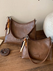 Vintage brown faux leather handbags with wooden bead charm and adjustable straps