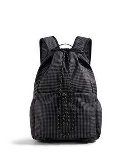 Black drawstring backpack with white grid pattern and multiple storage pockets