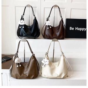 Group of vintage leather hobo bags in four colors with cute cloud plush charms