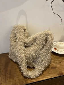Oatmeal plush faux shearling tote bag for women featuring a soft textured winter design