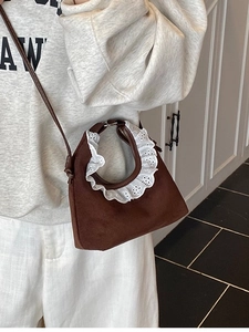 Brown faux suede mini crossbody bag with delicate white lace trim and slim shoulder strap