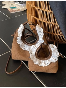 Brown suede bucket bag set with elegant white lace handle trim and thin shoulder straps