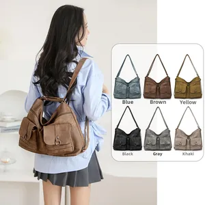 Detail showing vintage soft leather texture and multi-pocket design on backpack