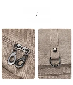 Detail shot of the durable fabric texture with dual zippers and a metal D-ring design