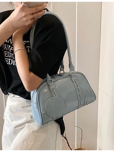 Minimalist light blue soft faux leather tote bag with drawstring and silver rivets