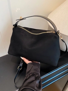 Large black suede tote bag with gold hardware for autumn and winter commuting style