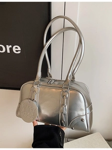 Silver metallic soft leather Boston tote bag with dual straps and round charm detail